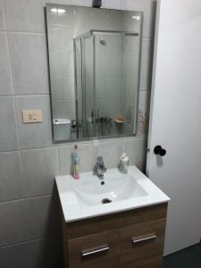 a bathroom with a sink and a mirror at -Precioso apartamento en pleno corazón de A Guarda in A Guarda