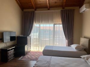 Postel nebo postele na pokoji v ubytování B Boutique Hotel