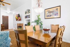 a dining room with a wooden table and chairs at LV262 2BR 2BA Legacy Villa with Mnt Views in La Quinta