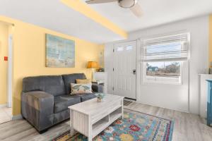 a living room with a couch and a coffee table at Walk to Beach Playground Lighthouse North End in Newburyport +98 photos