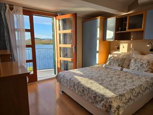 Postel nebo postele na pokoji v ubytování Apartmani Gacina