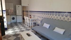 a living room with a couch and a table at La Marea in Chipiona