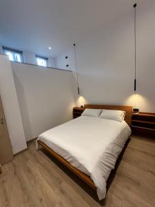 Ένα ή περισσότερα κρεβάτια σε δωμάτιο στο Liberty House Lake Como