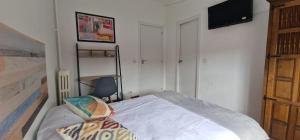 Ένα ή περισσότερα κρεβάτια σε δωμάτιο στο Hostal El Torero