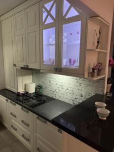 Кухня або міні-кухня у Jak apartman