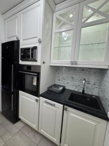 Кухня або міні-кухня у Jak apartman