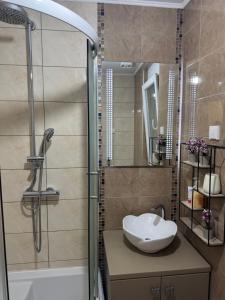 Ванна кімната в Jak apartman