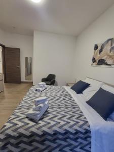 Postel nebo postele na pokoji v ubytování Le Gurne Apartment valle dell 'Alcantara