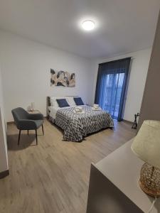 Postel nebo postele na pokoji v ubytování Le Gurne Apartment valle dell 'Alcantara + 2 fotografie
