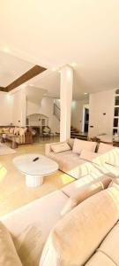 a large living room with couches and a table at Villa marrakech in Marrakech