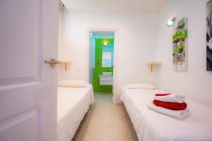 Postel nebo postele na pokoji v ubytování Seagulls melody C-208