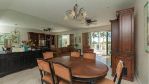 a dining room and living room with a table and chairs at 408 Mariners Club in Key Largo