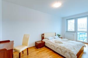 Posteľ alebo postele v izbe v ubytovaní Apartamenty Diva Kołobrzeg