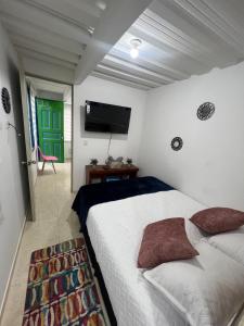 Postel nebo postele na pokoji v ubytování Apartaestudio astromelias A