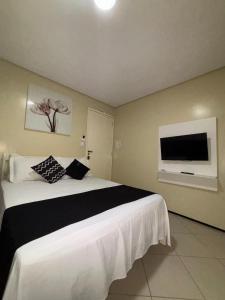 Cama ou camas em um quarto em Sr Hotel