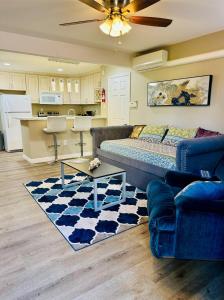 a living room with a couch and a kitchen at Comfy & Family Friendly in Central San Diego in San Diego