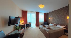Posteľ alebo postele v izbe v ubytovaní Apartamenty Diva Kołobrzeg