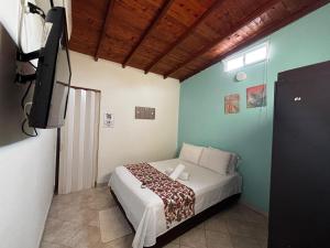 Postel nebo postele na pokoji v ubytování cabaña 83 Santorini