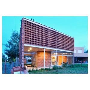 a red brick building with a brick wall at Casa PDS in La Porteña