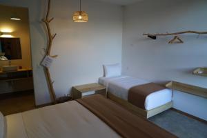 Postel nebo postele na pokoji v ubytování Hotel con Corazon Monteverde