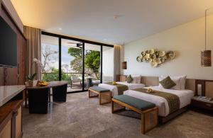 Postel nebo postele na pokoji v ubytování Sumitra Luxury Villas & Resort by Pramana + 37 fotografií