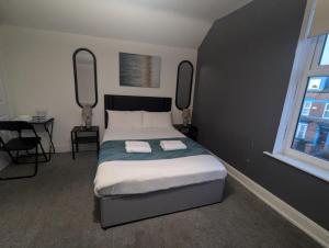 Ένα ή περισσότερα κρεβάτια σε δωμάτιο στο Contractor Rooms South Shields