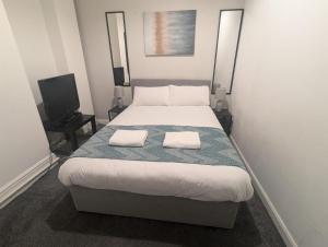 Ένα ή περισσότερα κρεβάτια σε δωμάτιο στο Contractor Rooms South Shields +3 φωτογραφίες