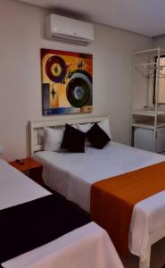 Cama ou camas em um quarto em Sr Hotel