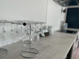a bunch of wine glasses sitting on a counter at AZEST awaji in Noda
