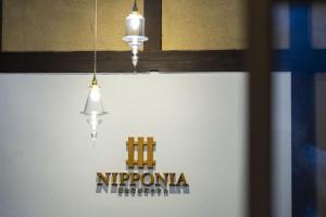 Et logo, certifikat, skilt eller en pris der bliver vist frem på NIPPONIA 福住 宿場町