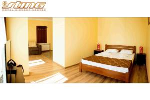 Posteľ alebo postele v izbe v ubytovaní Sting Hotel & Event Palace
