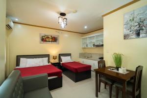 Postel nebo postele na pokoji v ubytování Mifaña Suites - Panglao Island