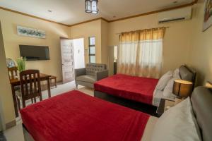 Postel nebo postele na pokoji v ubytování Mifaña Suites - Panglao Island