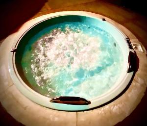 a pool of water with a object in the middle at El Remanso del Colibri in La Vega +70 photos