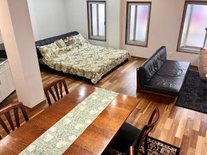 Letto o letti in una camera di 映画館みたいなお部屋で非日常体験 キッチン付きで家族も安心 1日1組限定貸切ステイ シンカイハウス
