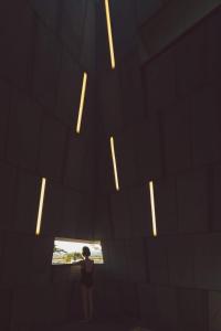 a person standing in front of a wall with lights at AroundFollie in Seogwipo +22 photos