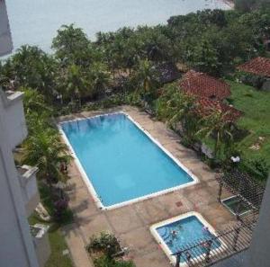 an overhead view of a swimming pool in a yard at Seri Bulan Coastal Homestay in Kampung Teluk Kemang +8 photos