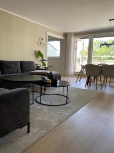 a living room with a couch and a table at Mineberget in Fredrikstad