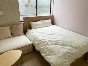 Ein Bett oder Betten in einem Zimmer der Unterkunft SANDBoX