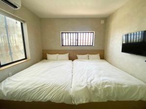 Ein Bett oder Betten in einem Zimmer der Unterkunft SANDBoX