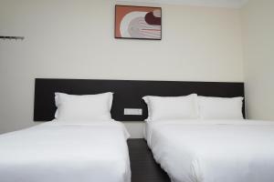 Postel nebo postele na pokoji v ubytování Anta Hotel