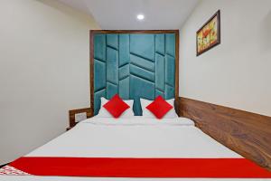 Postel nebo postele na pokoji v ubytování Hotel O Swagat Inn