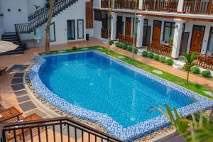 a swimming pool in the middle of a house at Dream1985 Hotel in Luang Prabang