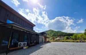 a building with a view of a mountain at Stay Gapyeong 2025 Renovation in Kwanch'ŏng-ni