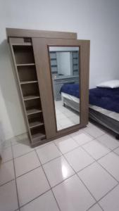 a mirror reflection of a bedroom with a bed and a bed sqor at CENTRAL APARTMENT, casa cuc in Panajachel