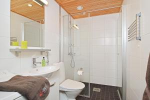 a bathroom with a toilet and a sink at Forenom Serviced Apartments Tampere Pyynikki in Tampere +50 photos