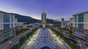 a city street with a tall building in the distance at The Ocean Resort in Hangho