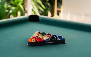a bowl of billiard balls on a pool table at Vila Ombak in Gili Trawangan