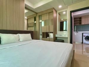 Ένα ή περισσότερα κρεβάτια σε δωμάτιο στο Utrip # DUSIT GRAND CONDO VIEW +11 φωτογραφίες