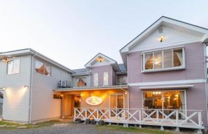 a large house with a purple at Pension Alhambra - Vacation STAY 56213v in Manazuru